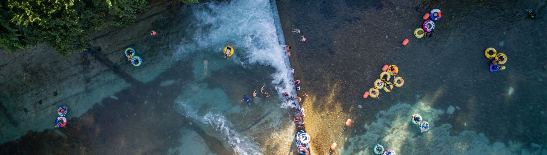 People with floaters at river