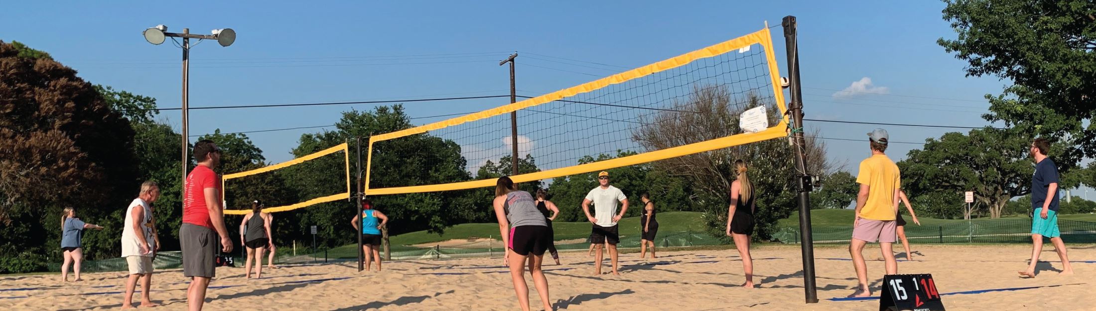 Park-goers enjoy playing sand volleyball in Landa Park