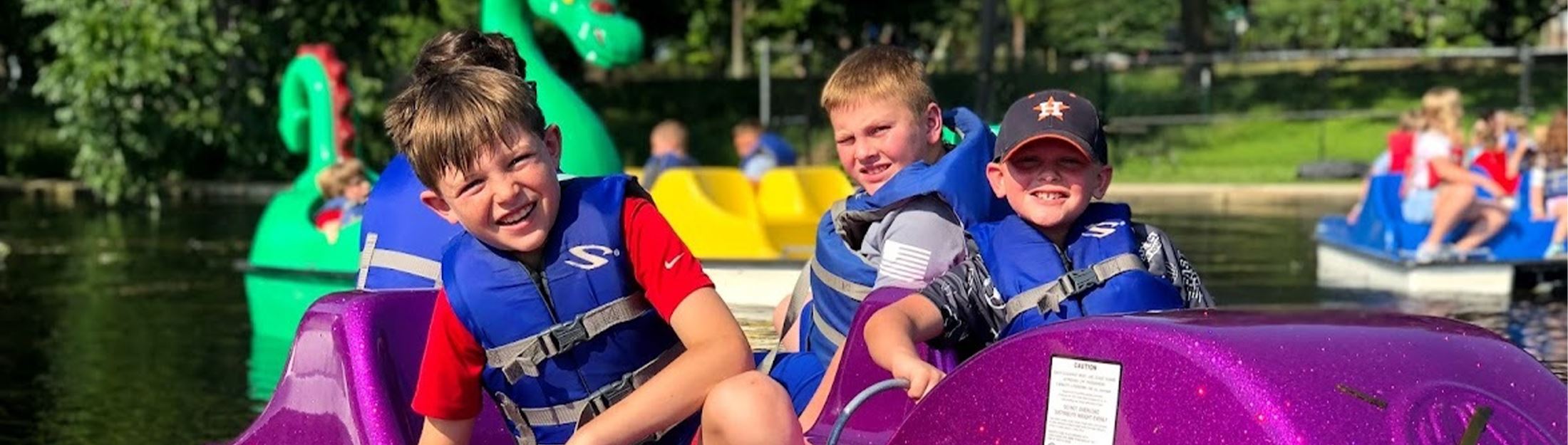 Kids enjoying the paddleboats in Landa Park