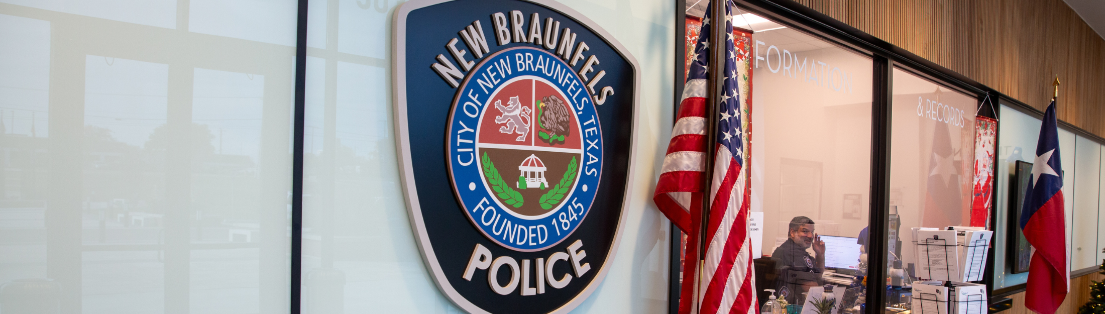 New Braunfels Police Department patch in the NBPD Headquarters lobby
