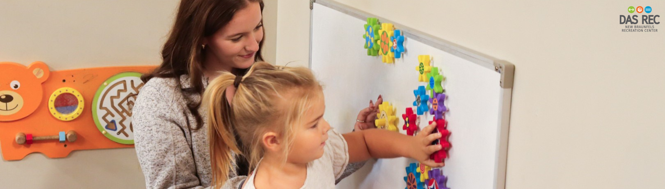 Kindercare Staff playing with Little Girl at Das Rec