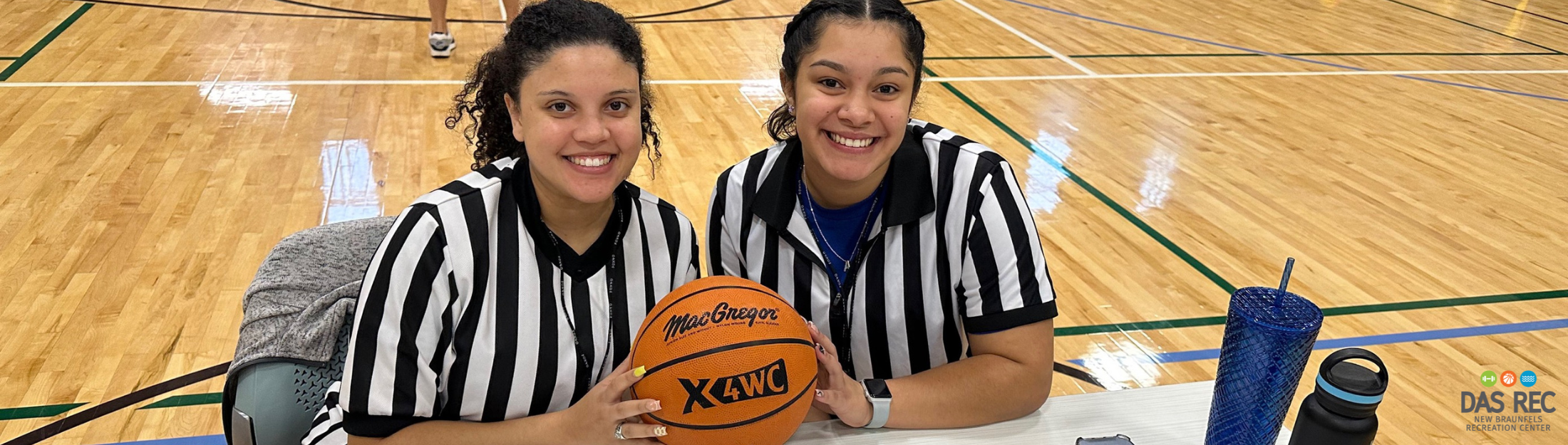 A pair of referees during a Das Rec basketball game