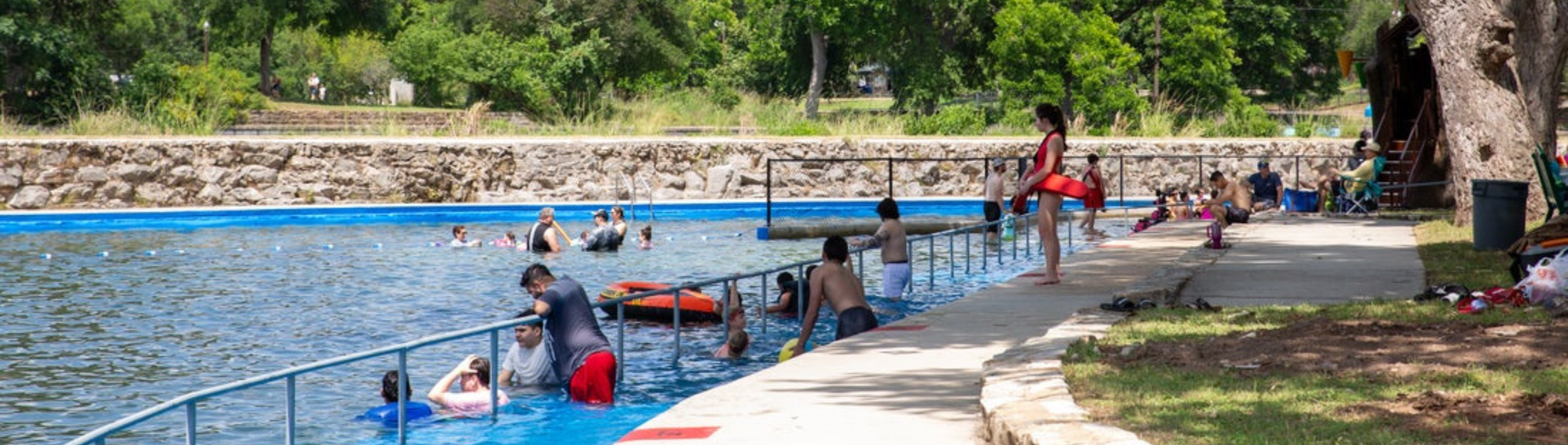 Swimmers enjoy the Springfed Pool in Landa Park